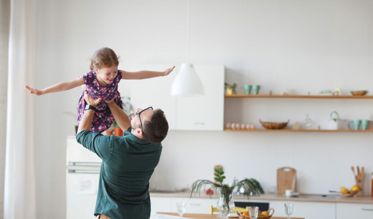 father playing with daughter