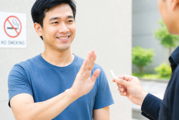 a man reject smoking invitation.